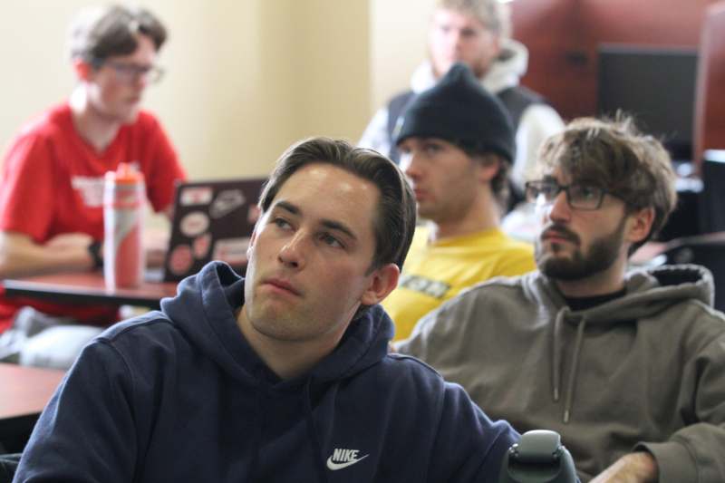 a group of people sitting in a room