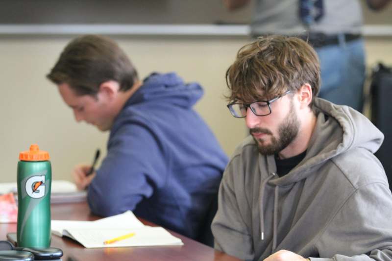 a man sitting at a desk