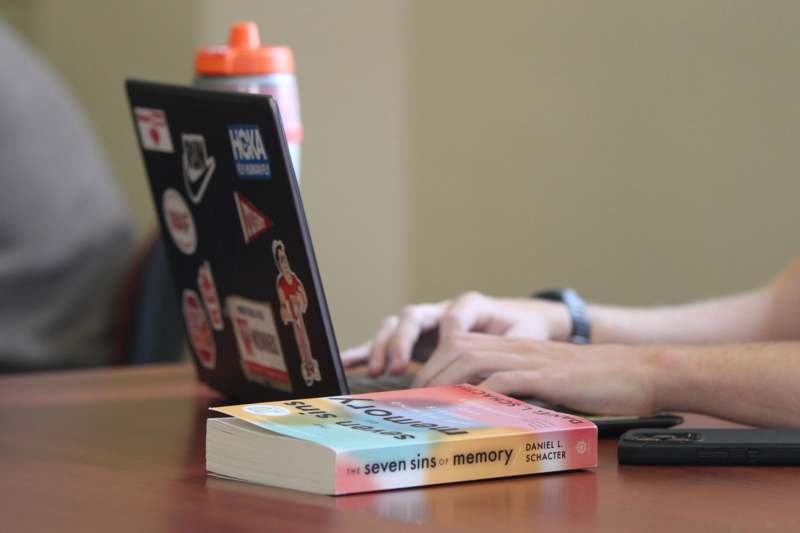 a person typing on a laptop