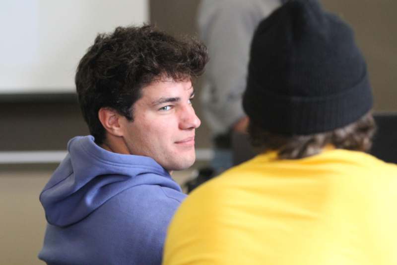 a man in a yellow shirt