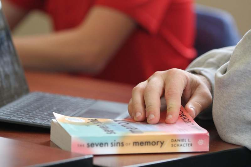 a hand touching a book