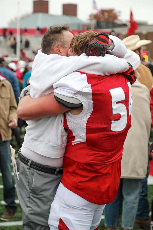 two people hugging each other