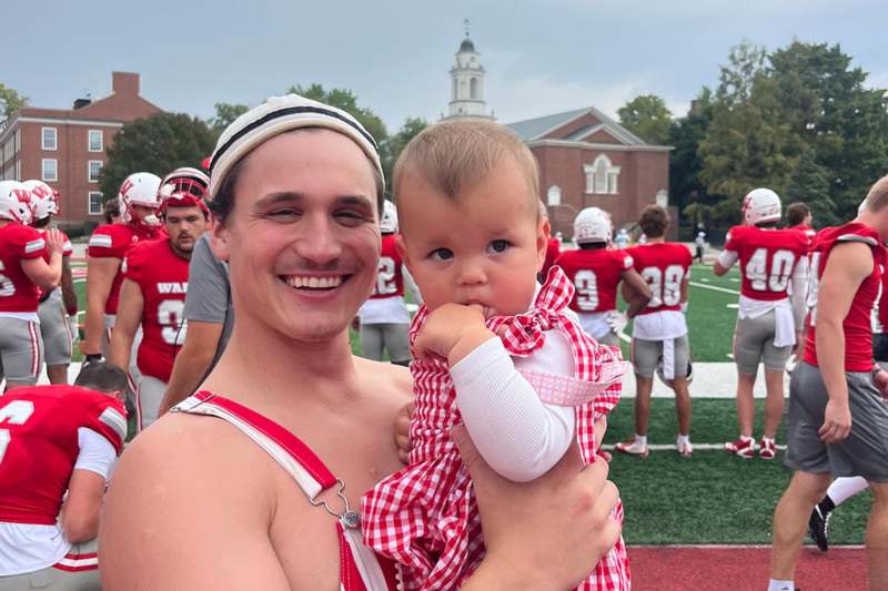 a man holding a baby
