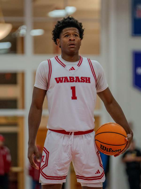 a man holding a basketball