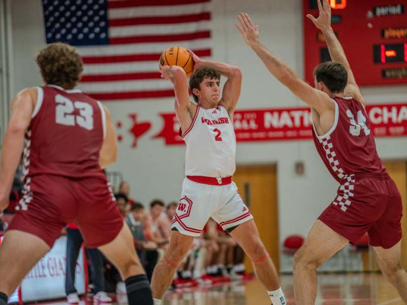 a group of men playing basketball