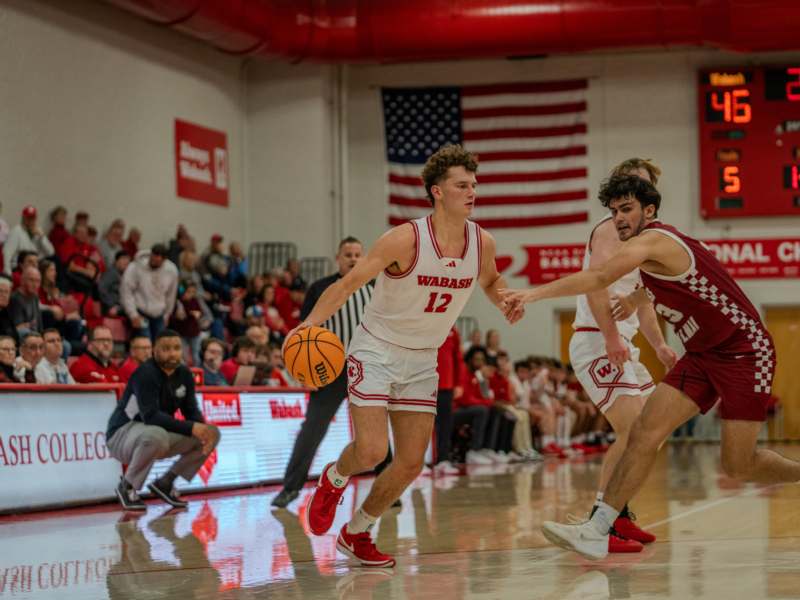 a group of men playing basketball