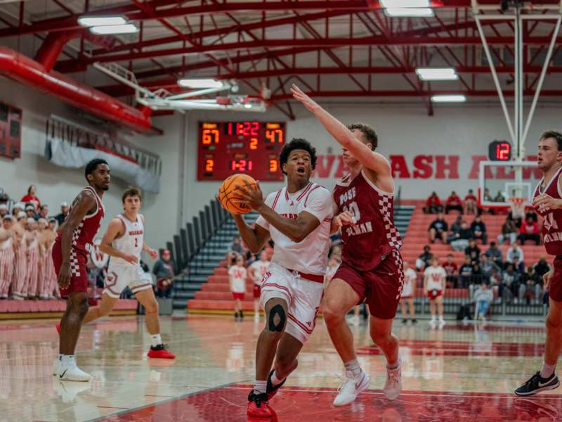 a group of men playing basketball