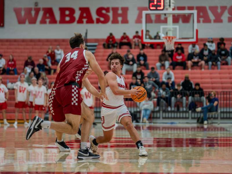 a group of men playing basketball