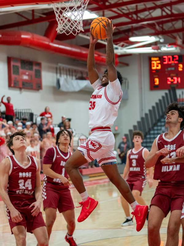a basketball player dunking a basketball