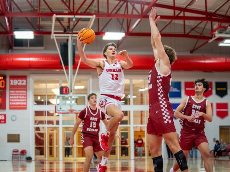 a group of men playing basketball