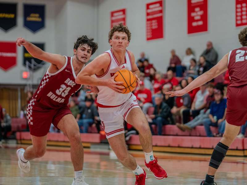 a group of men playing basketball