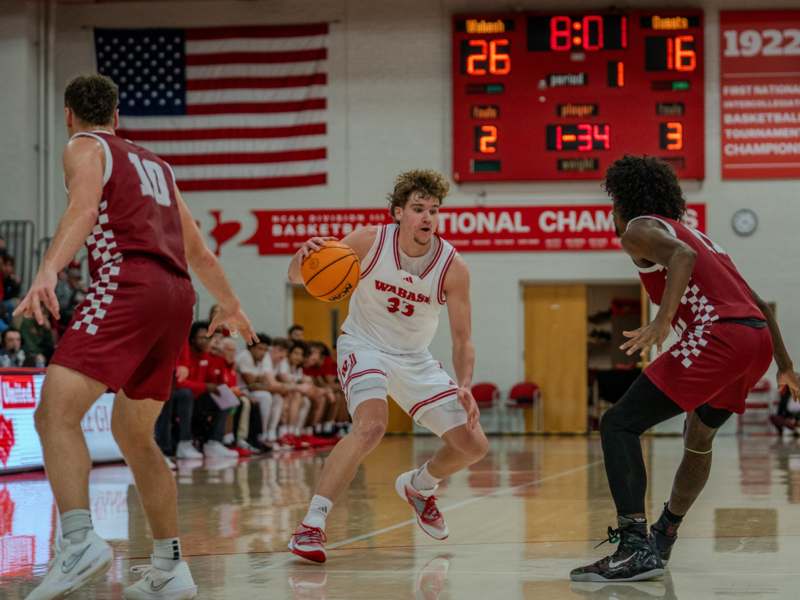 a basketball player dribbling a basketball