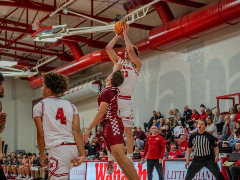 a group of people playing basketball