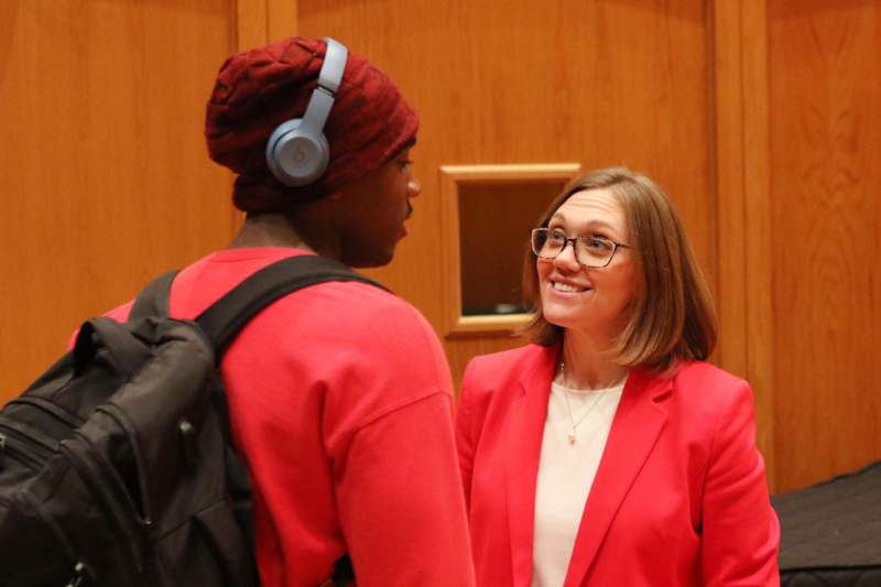 a woman and a man looking at each other