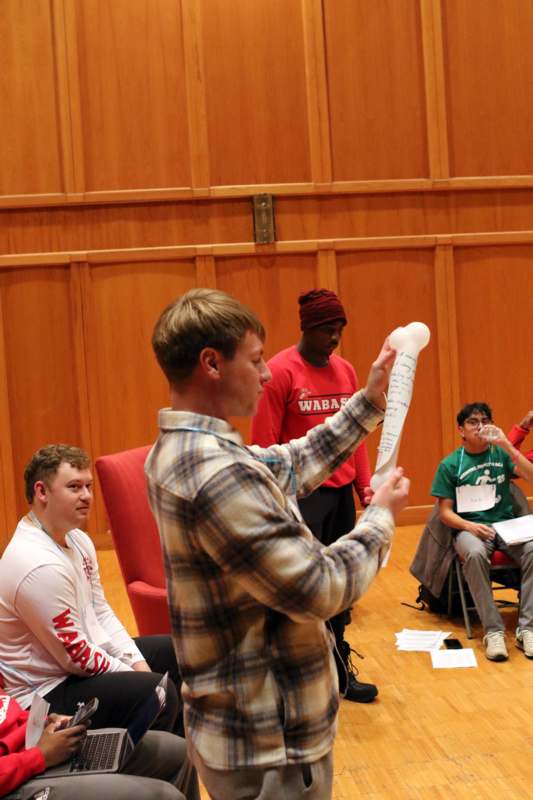 a man holding a piece of paper