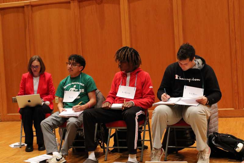 a group of people sitting in chairs