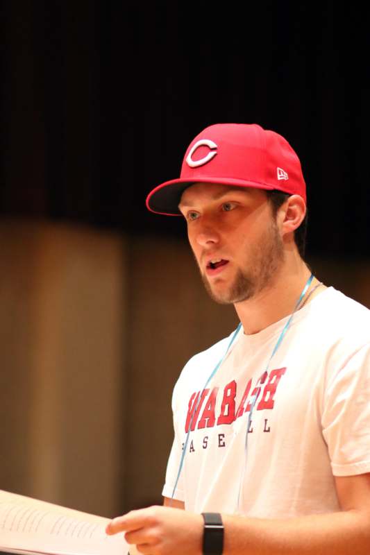 a man wearing a red hat