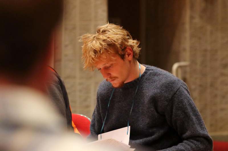 a man looking at papers