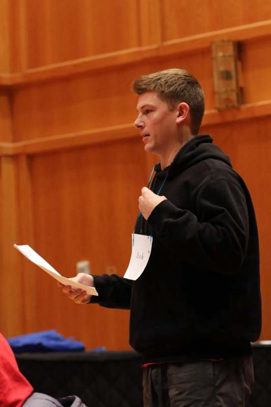 a man holding a piece of paper