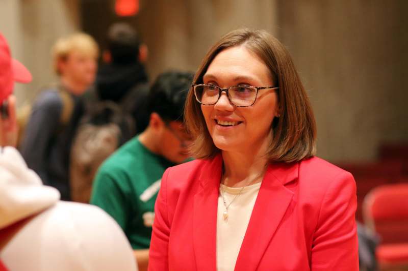 a woman in a red jacket