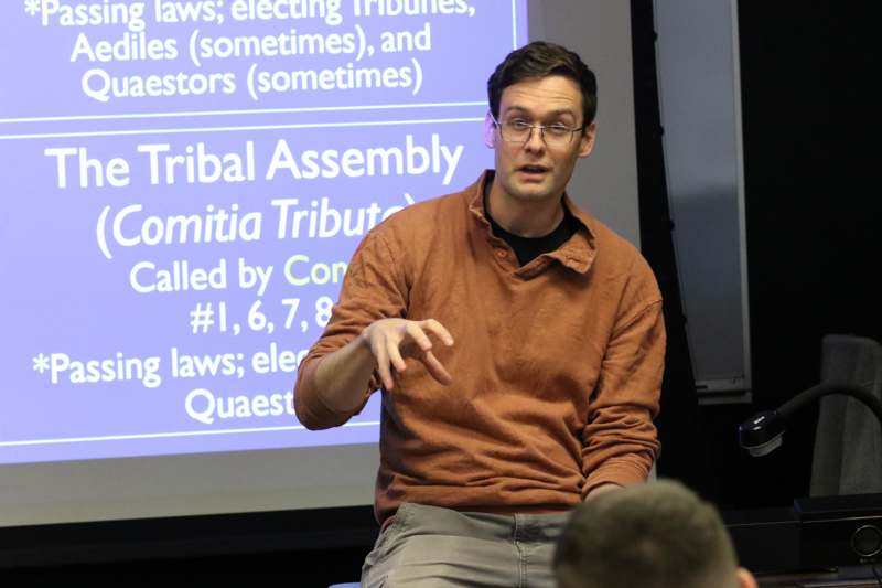a man in a brown shirt