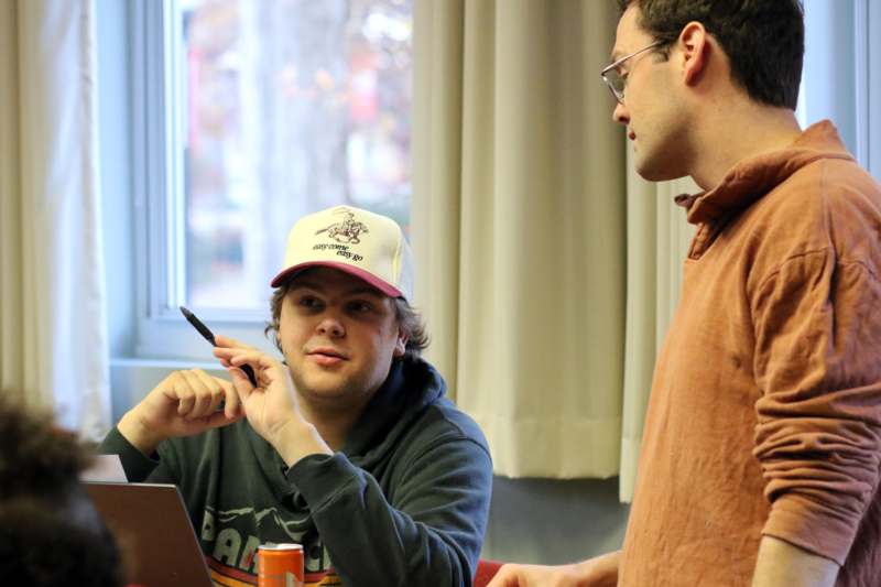 a man looking at another man