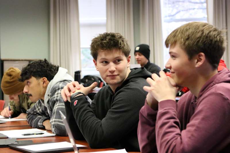 a group of people sitting at a table