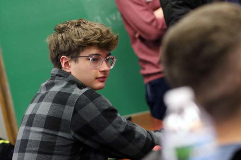 a boy sitting at a table
