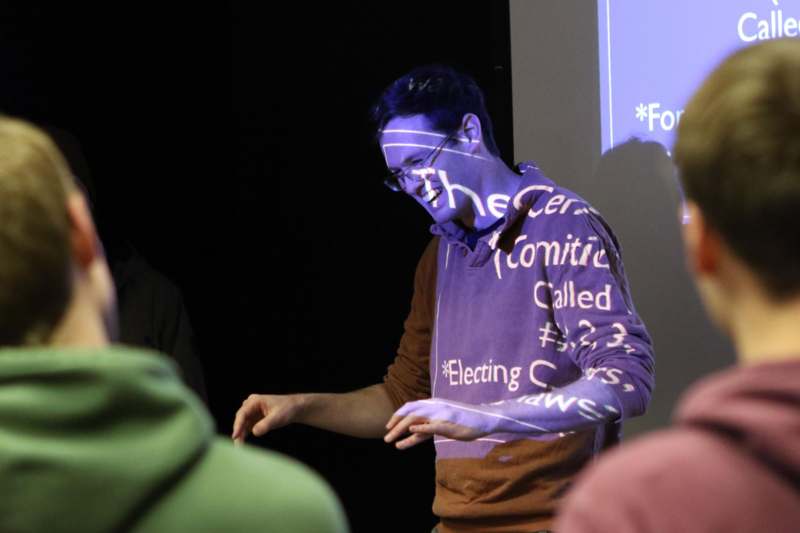 a man in a purple shirt