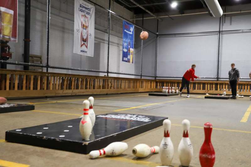 a person throwing a bowling ball