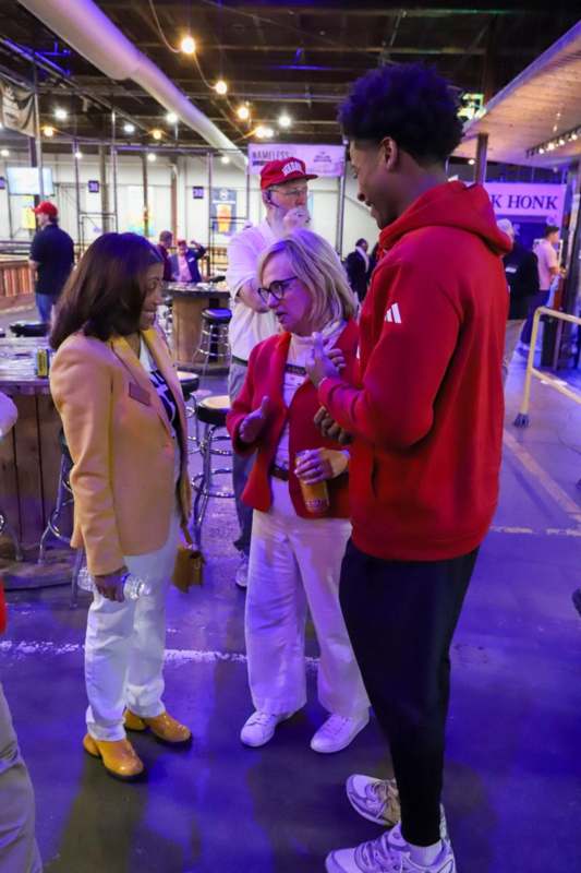 a group of people standing in a room