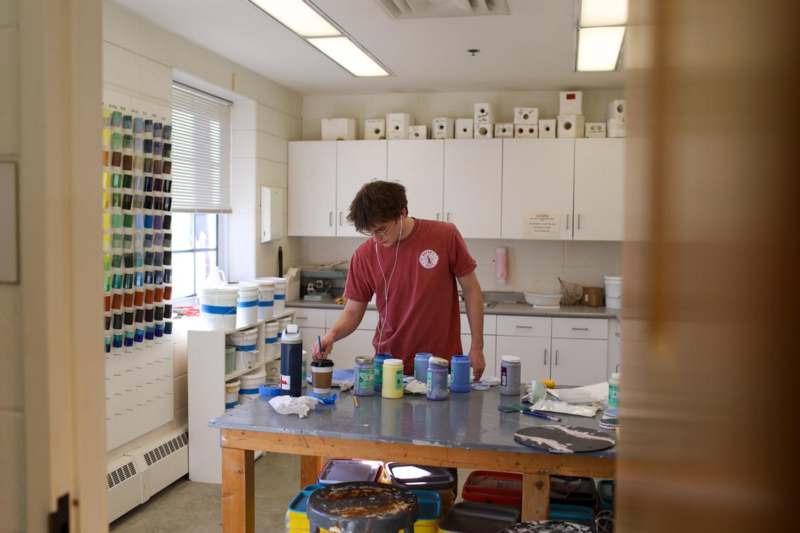 a man painting a table