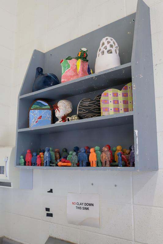 a shelf with many different colored objects