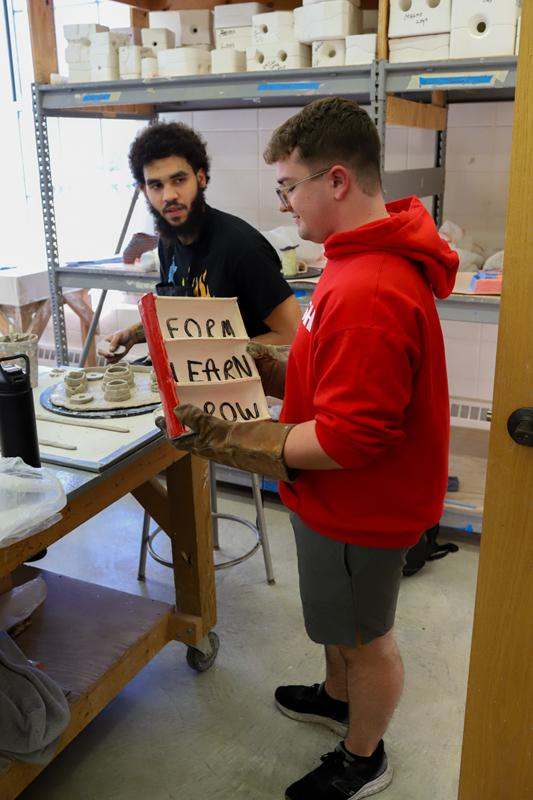 a man holding a book with a sign on it