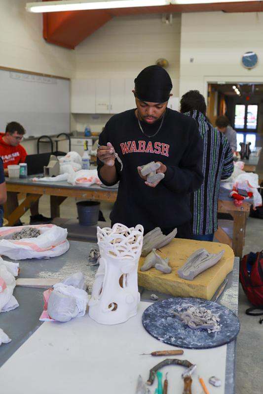 a man working on a sculpture