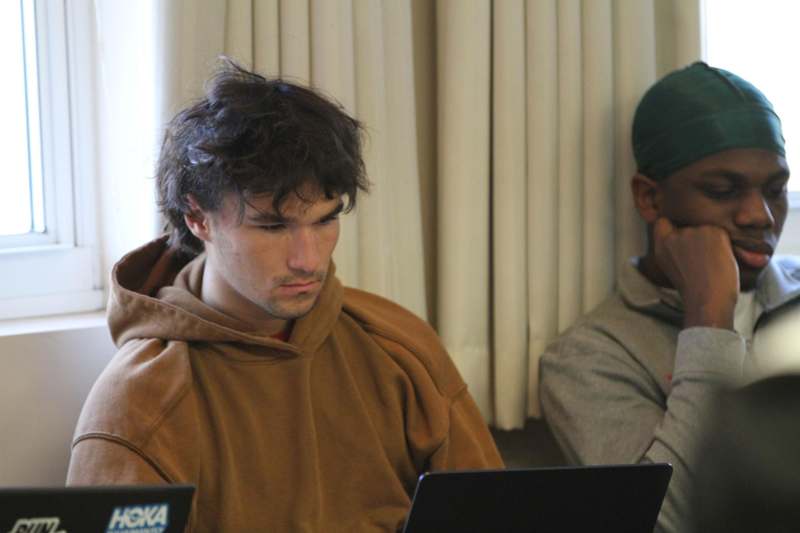 a man looking at a laptop