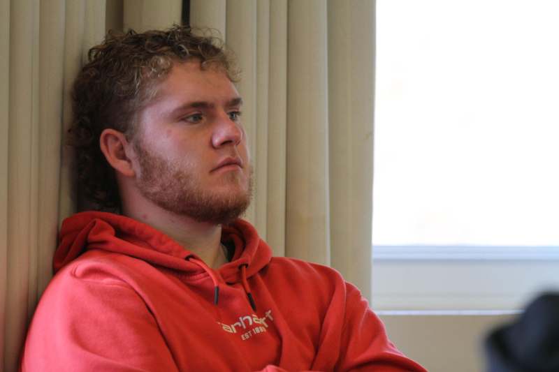 a man in a red sweatshirt