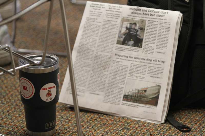 a newspaper and a cup