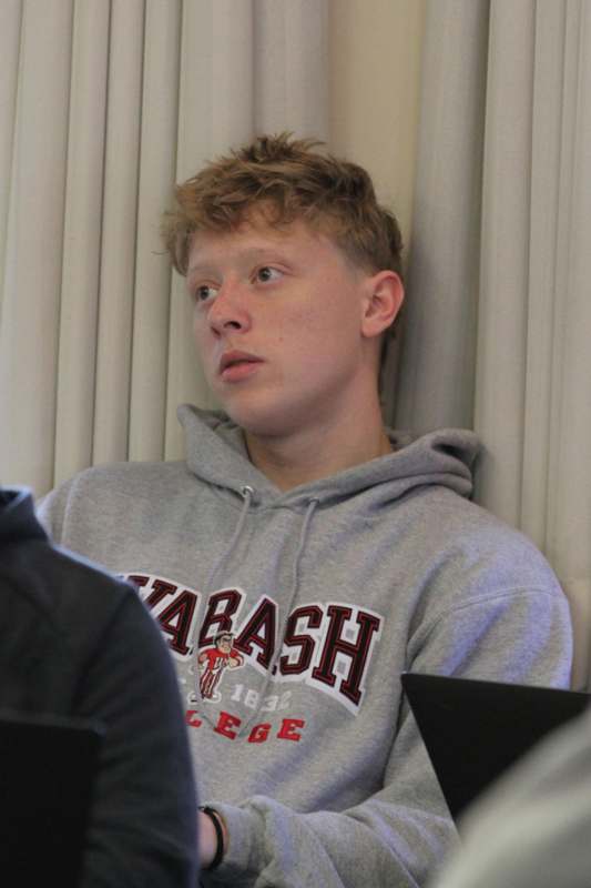 a man in a grey sweatshirt