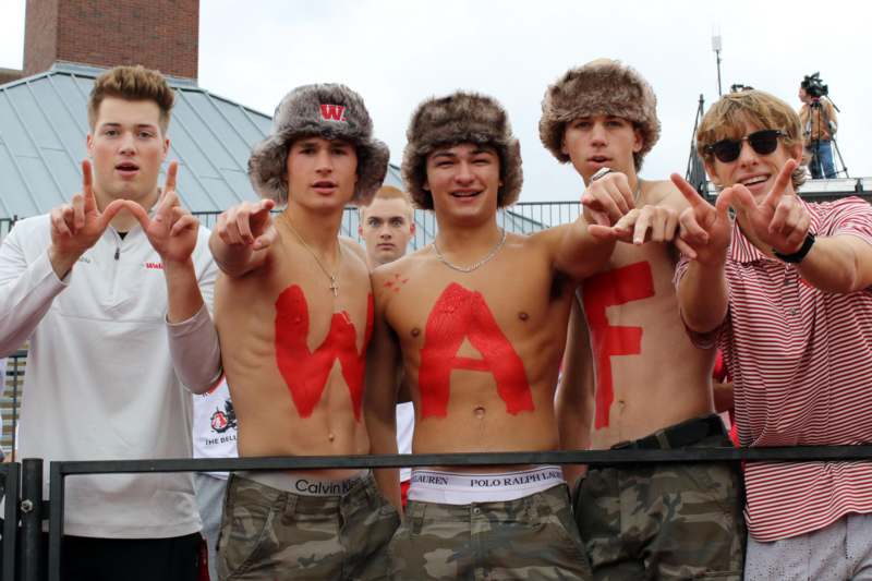 a group of men with letters on their shirts