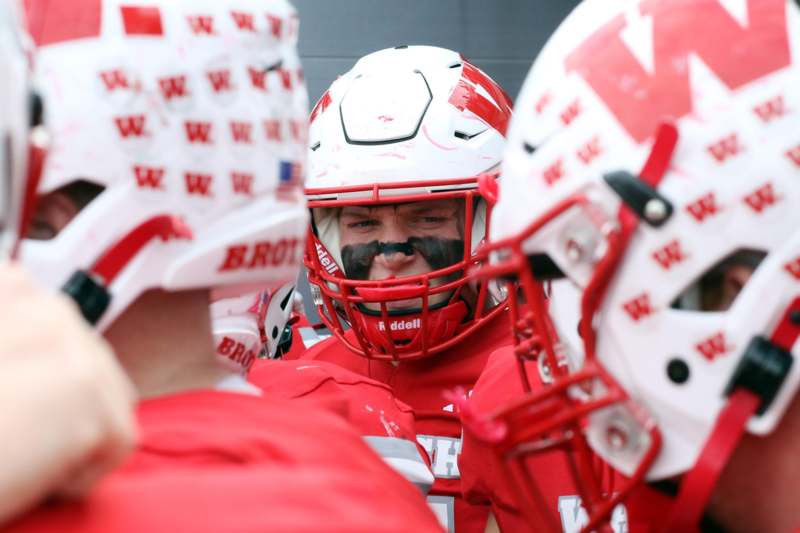 a group of people wearing football helmets