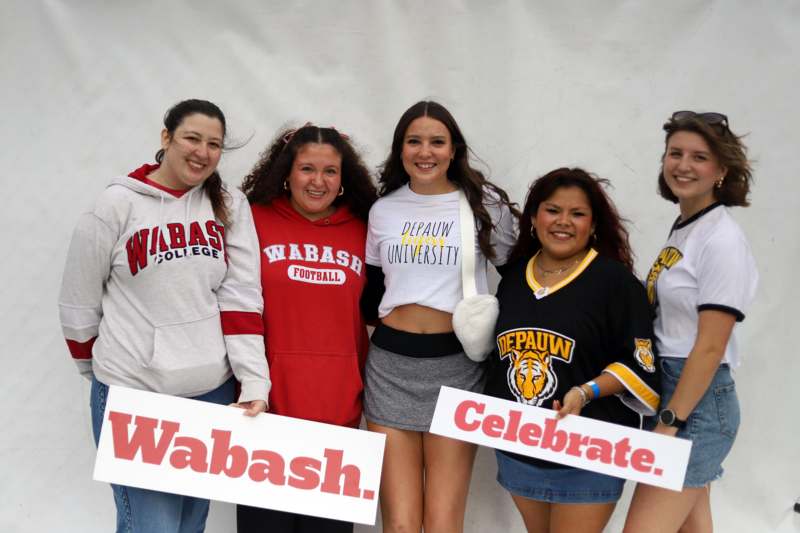 a group of women holding signs