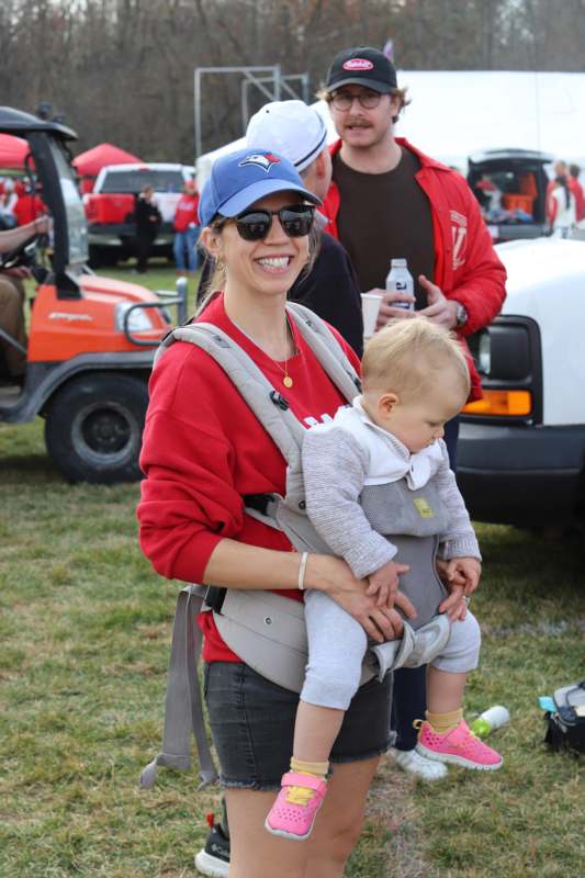 a woman carrying a baby