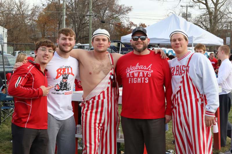a group of men wearing striped pants
