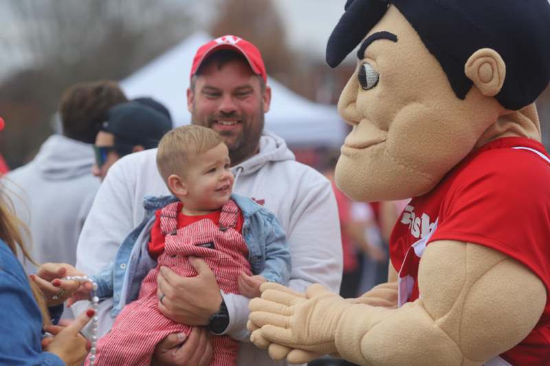 a man holding a baby
