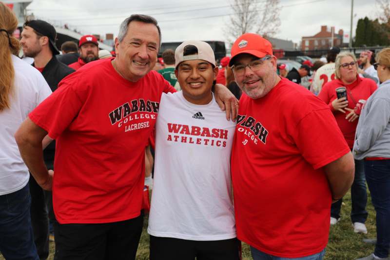 a group of men in red shirts