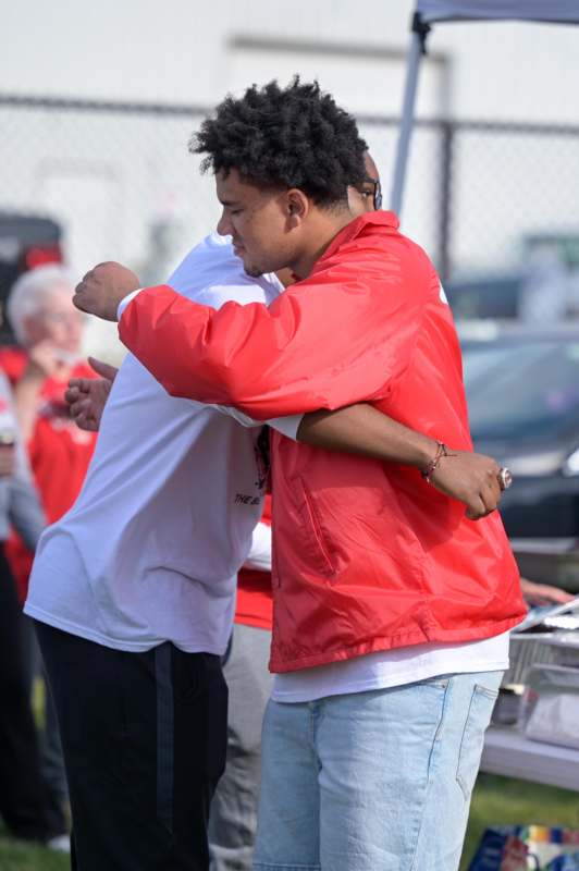 a group of men hugging