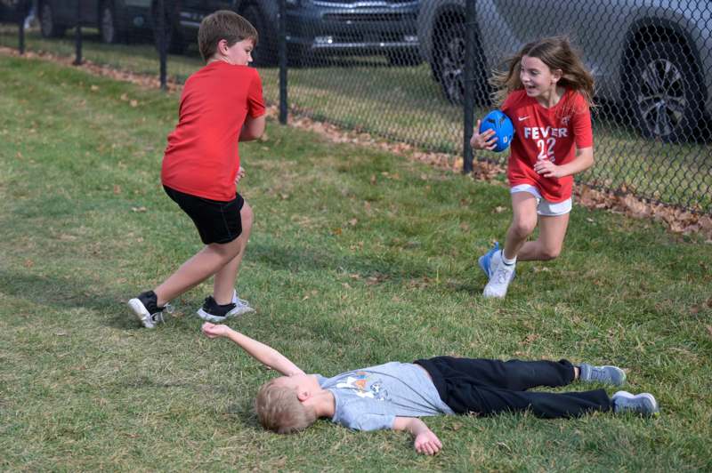 a group of kids playing with a ball