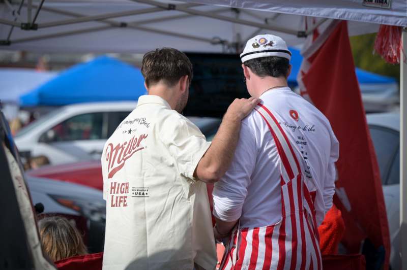two men standing next to each other