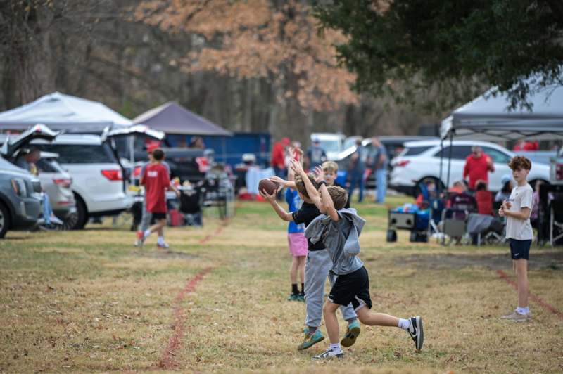 a group of kids playing football